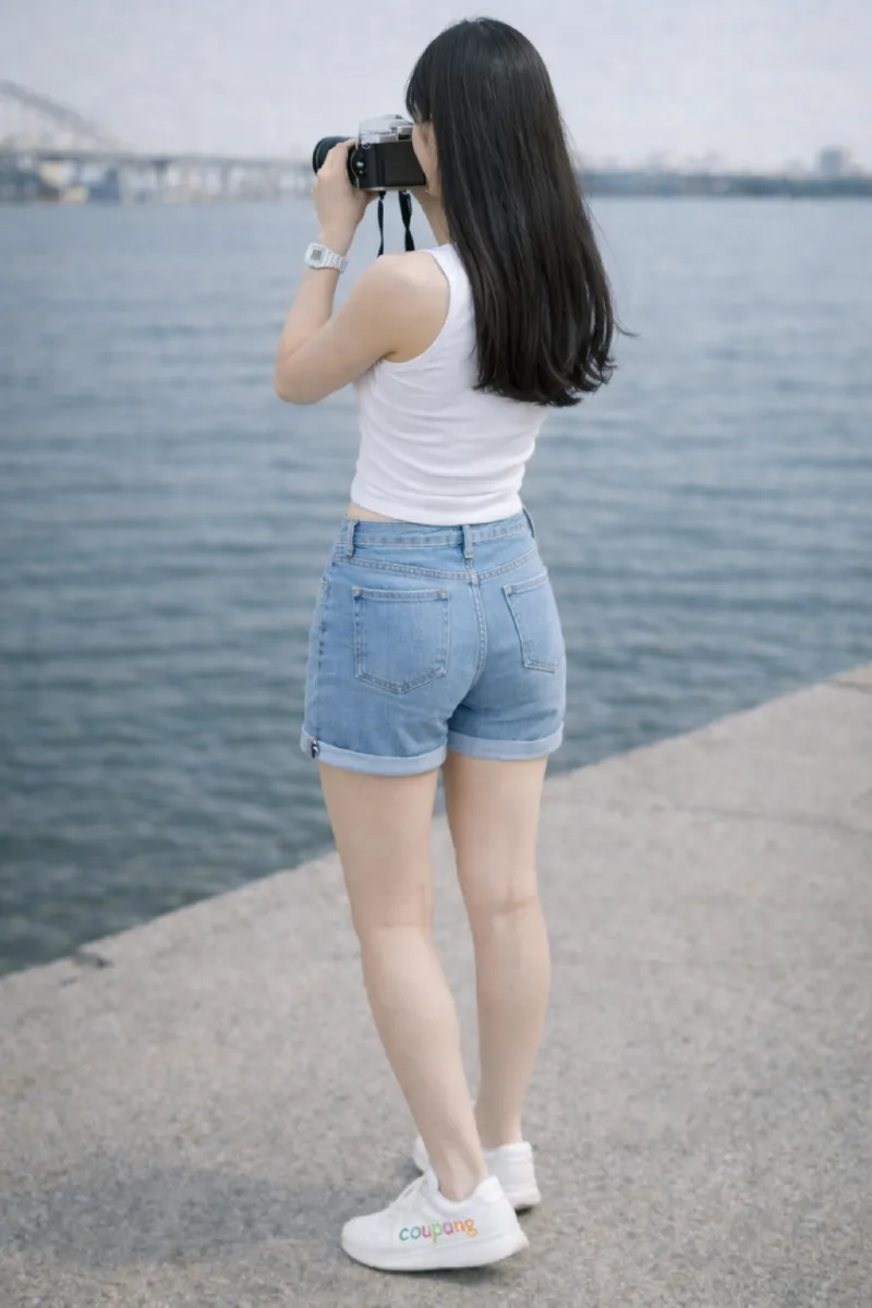 Photographer by the waterfront with camera f91w.png